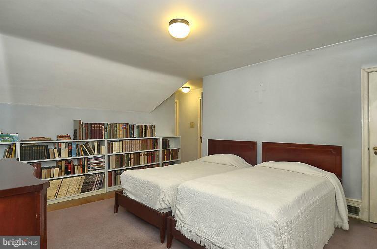 10163 Sutherland Road Silver Spring, MD 20901 - Photo 25 of 28 a bedroom with a bed and a window
