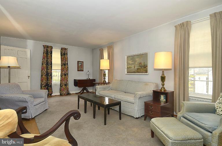 10163 Sutherland Road Silver Spring, MD 20901 - Photo 5 of 28 a living room with furniture and a window