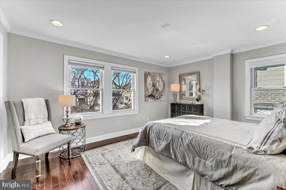 135 Sycamore Road Havertown, PA 19083 - Photo 12 of 33 a bedroom with a bed and a chair