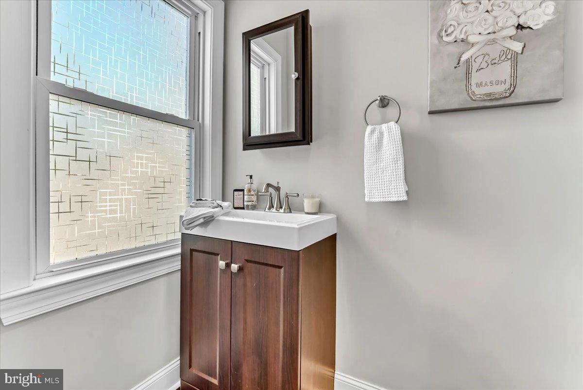 135 Sycamore Road Havertown, PA 19083 - Photo 15 of 33 a bathroom with a sink vanity and a mirror
