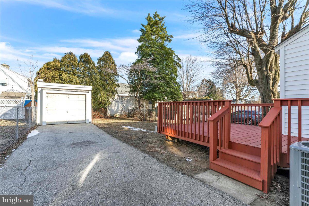 135 Sycamore Road Havertown, PA 19083 - Photo 22 of 33 a view of a house with a yard and wooden fence