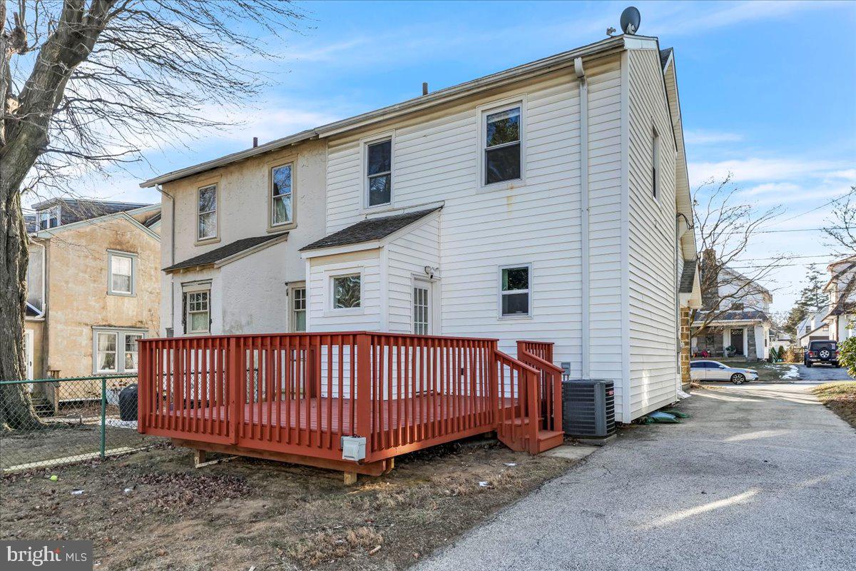 135 Sycamore Road Havertown, PA 19083 - Photo 23 of 33 a view of a house with a yard and deck