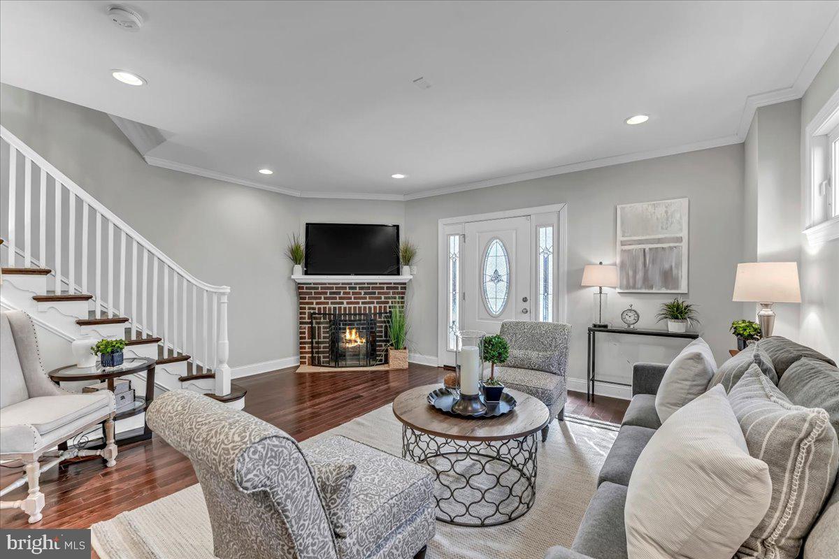 135 Sycamore Road Havertown, PA 19083 - Photo 5 of 33 a living room with furniture fireplace and a table