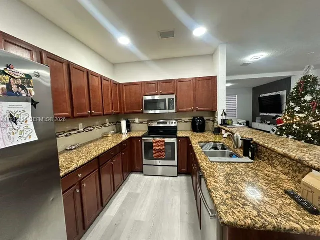 a view of a tables and chairs in a room