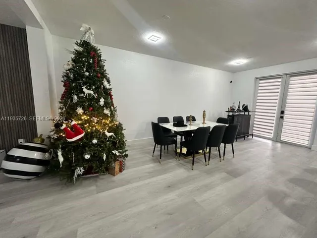 a room with furniture and a flat screen tv