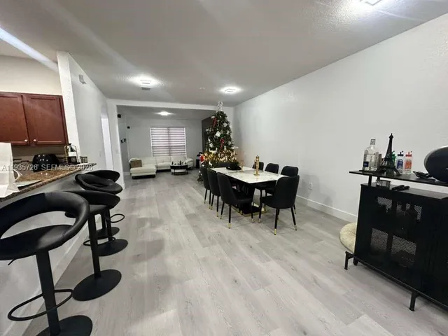 a kitchen with a table and chairs in it