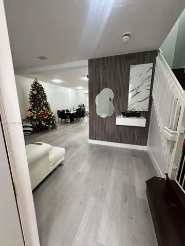 a view of entryway with wooden floor