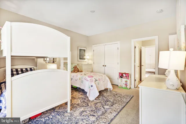 a bed room with a bed and a couch