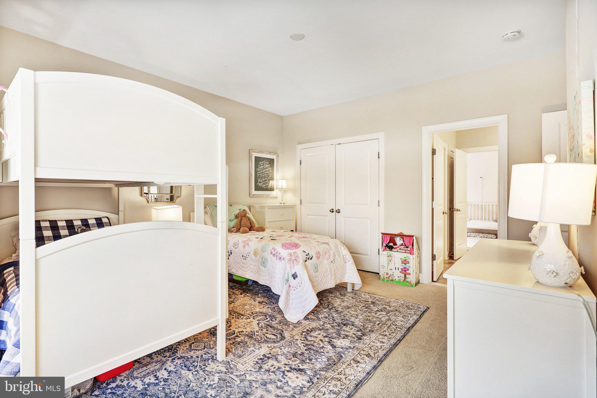 8028 Wellington Road Alexandria, VA 22308 - Photo 17 of 43 a bed room with a bed and a couch