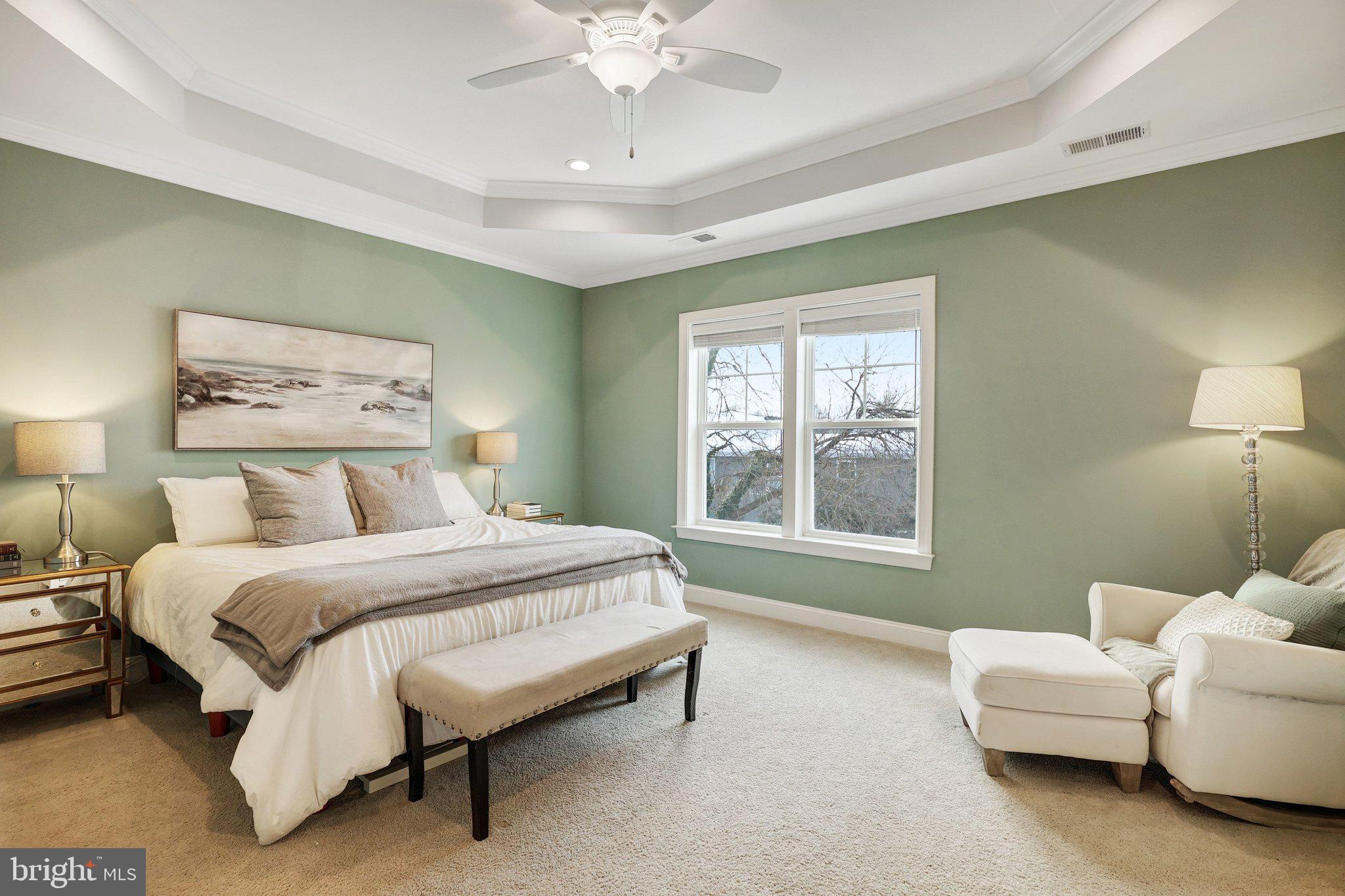 8028 Wellington Road Alexandria, VA 22308 - Photo 26 of 48 a spacious bedroom with a bed and a couch