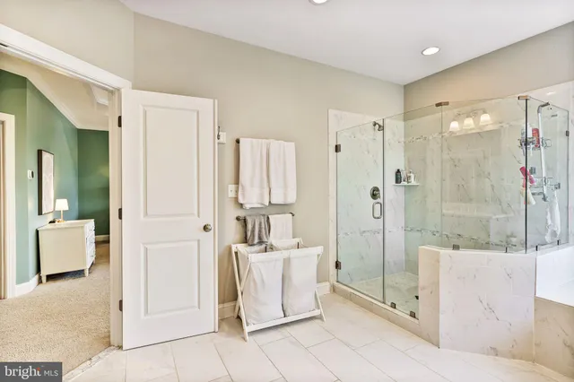a bathroom with a tub shower and sink