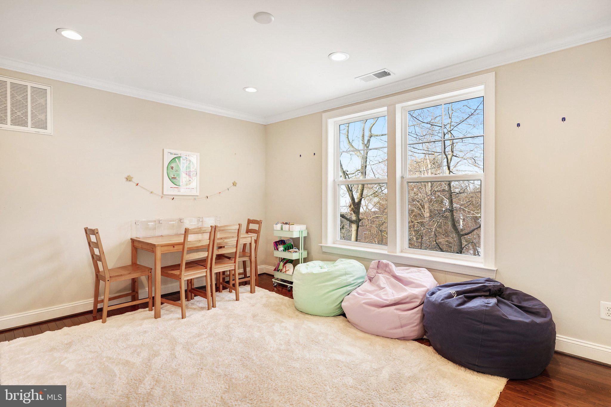 8028 Wellington Road Alexandria, VA 22308 - Photo 31 of 43 a living room with furniture and a large window