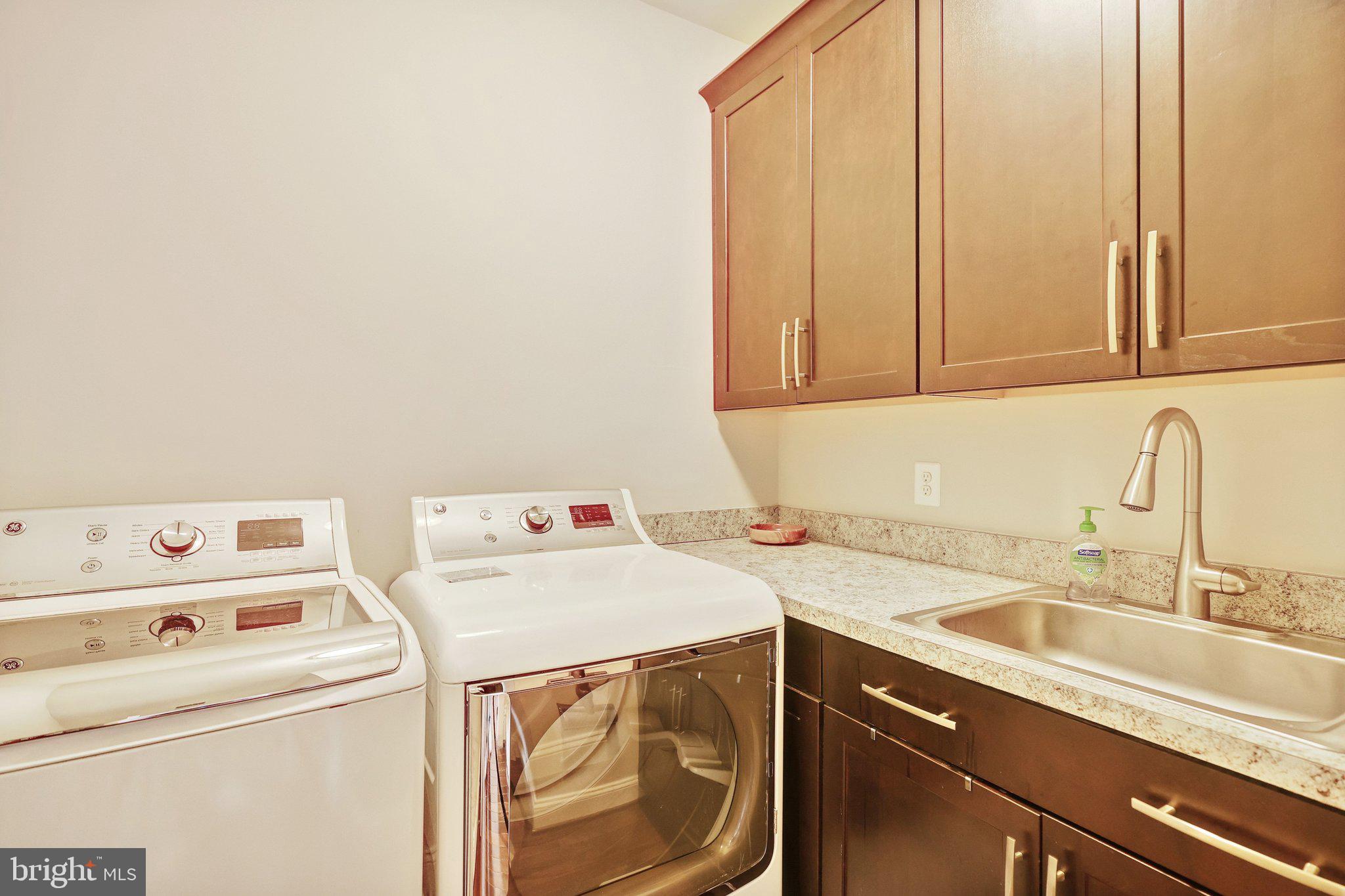8028 Wellington Road Alexandria, VA 22308 - Photo 31 of 48 a utility room with dryer and washer