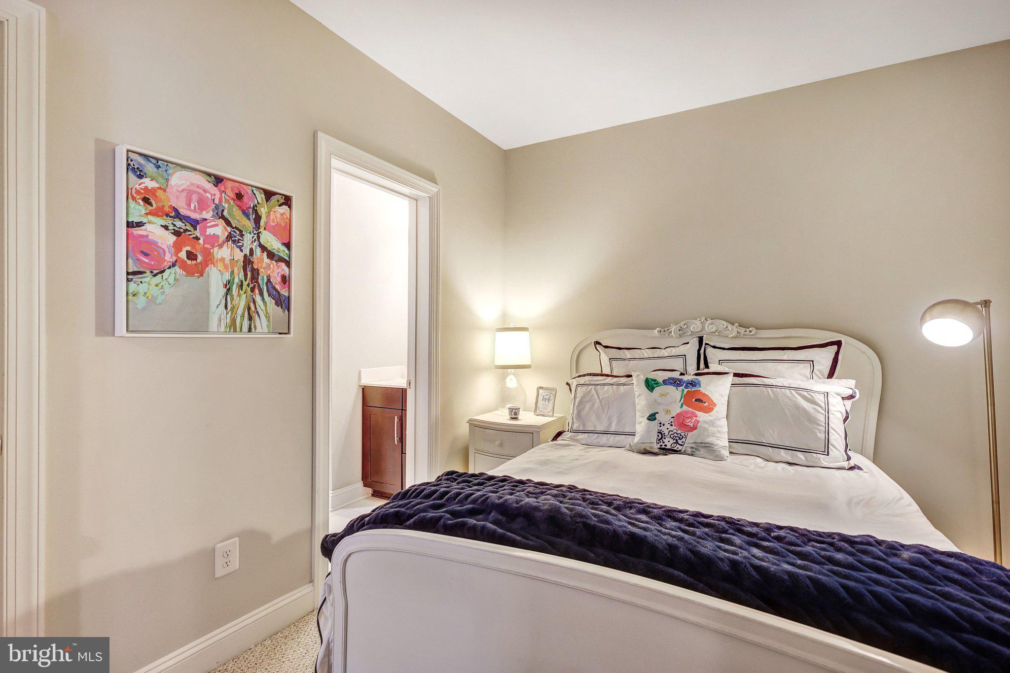 8028 Wellington Road Alexandria, VA 22308 - Photo 44 of 48 a bedroom with a bed and a window