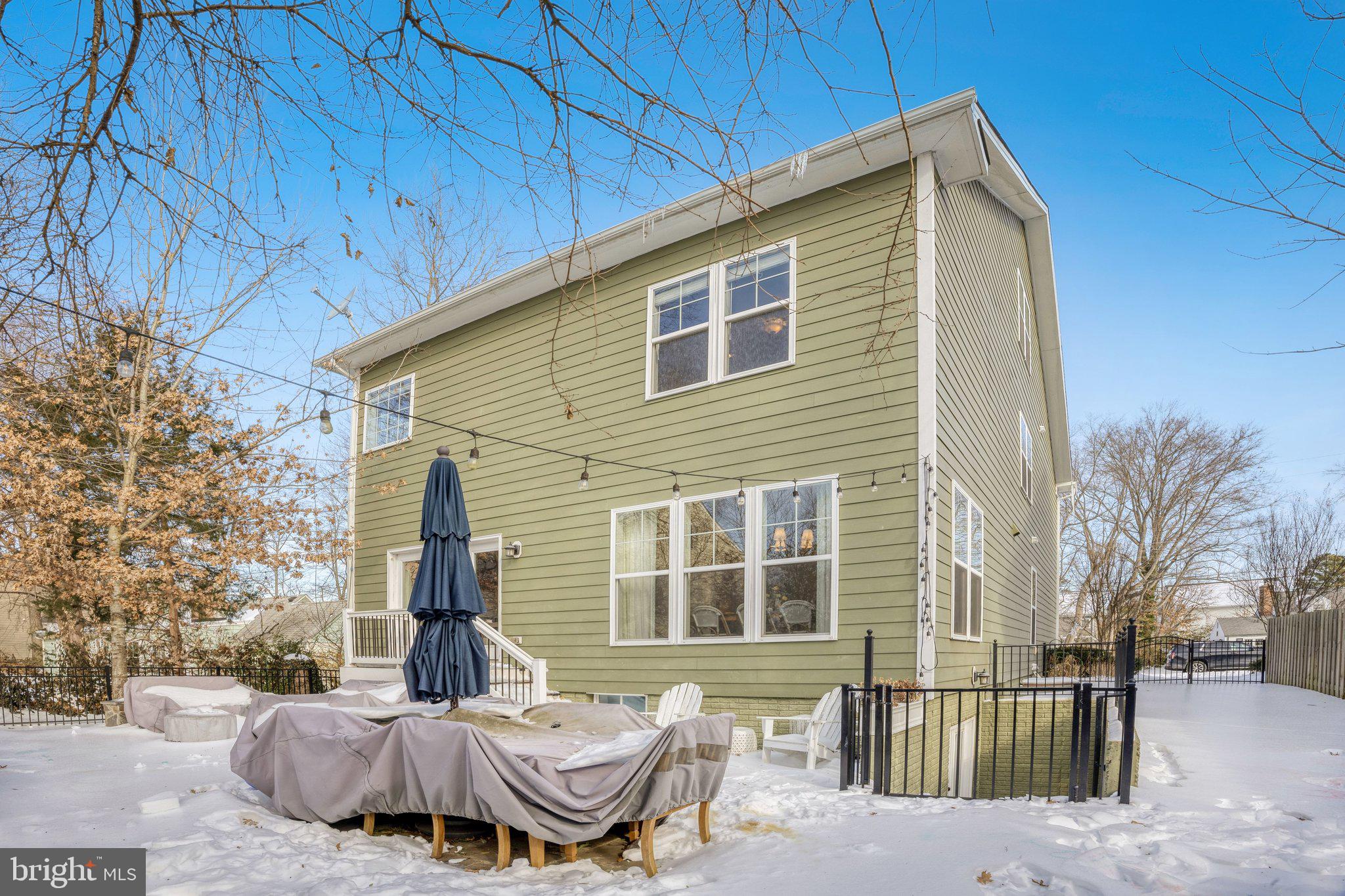 8028 Wellington Road Alexandria, VA 22308 - Photo 47 of 48 a view of a house with a patio
