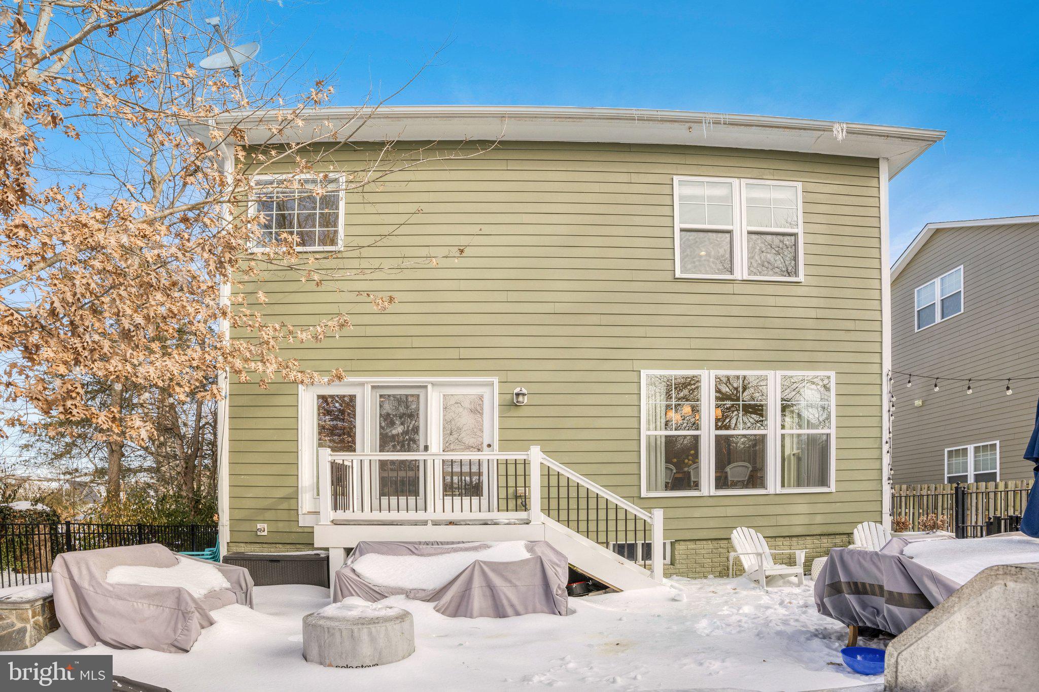 8028 Wellington Road Alexandria, VA 22308 - Photo 48 of 48 a front view of a house with outdoor seating