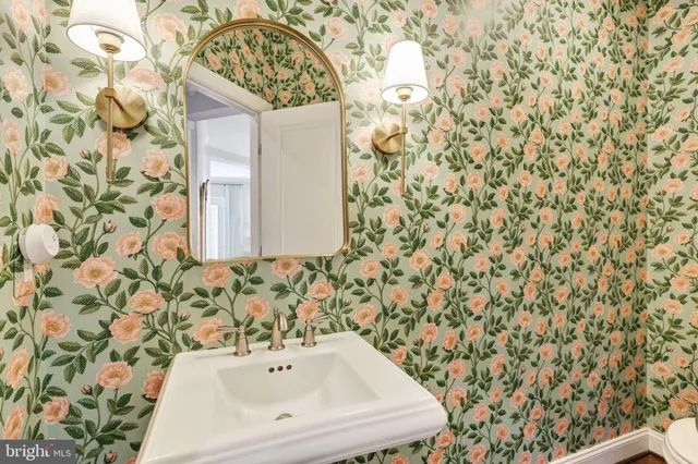a bathroom with a shower curtain and a sink