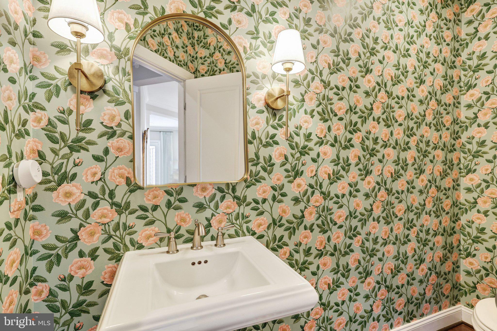 8028 Wellington Road Alexandria, VA 22308 - Photo 5 of 43 a bathroom with a shower curtain and a sink
