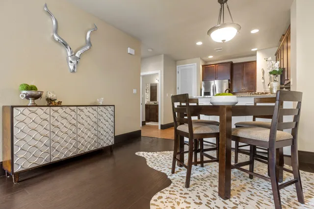 a view of a dining room with furniture window and wooden floor