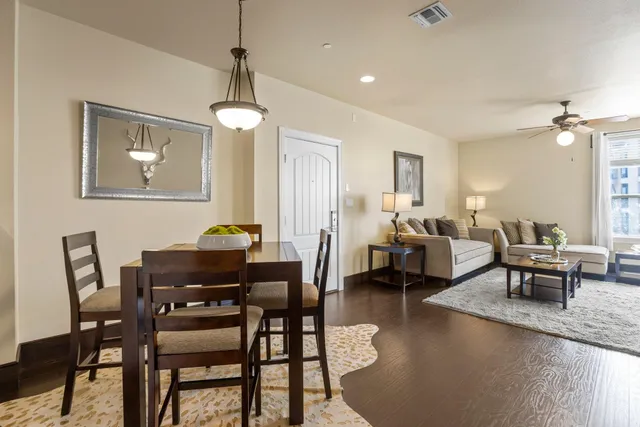 a kitchen with granite countertop a refrigerator stove and microwave