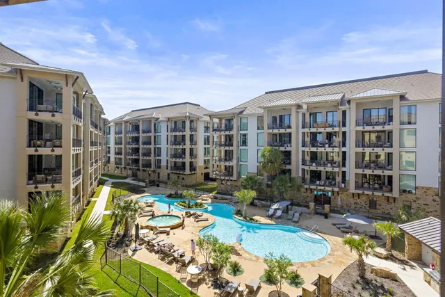 a living room with furniture a table and a large window
