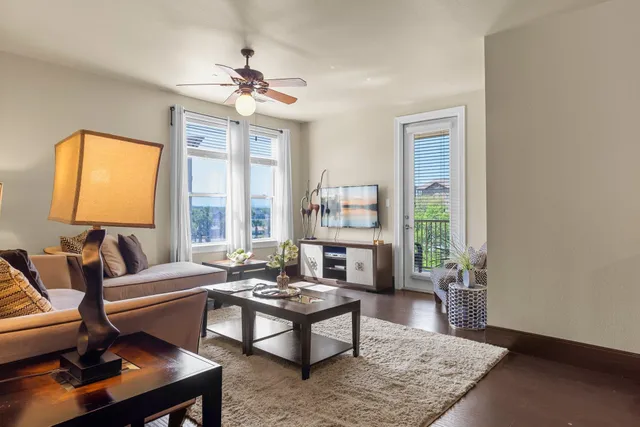 a living room with furniture and a window
