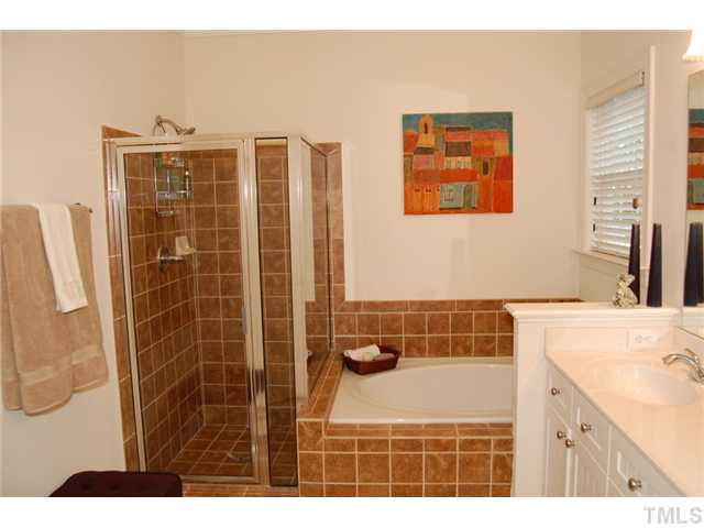1148 Harp Street Raleigh, NC 27604 - Photo 9 of 23 Chrome and brushed nickel detailing, raised height double sink beadboard vanity plus whirlpool tub. Master Bath/Spa