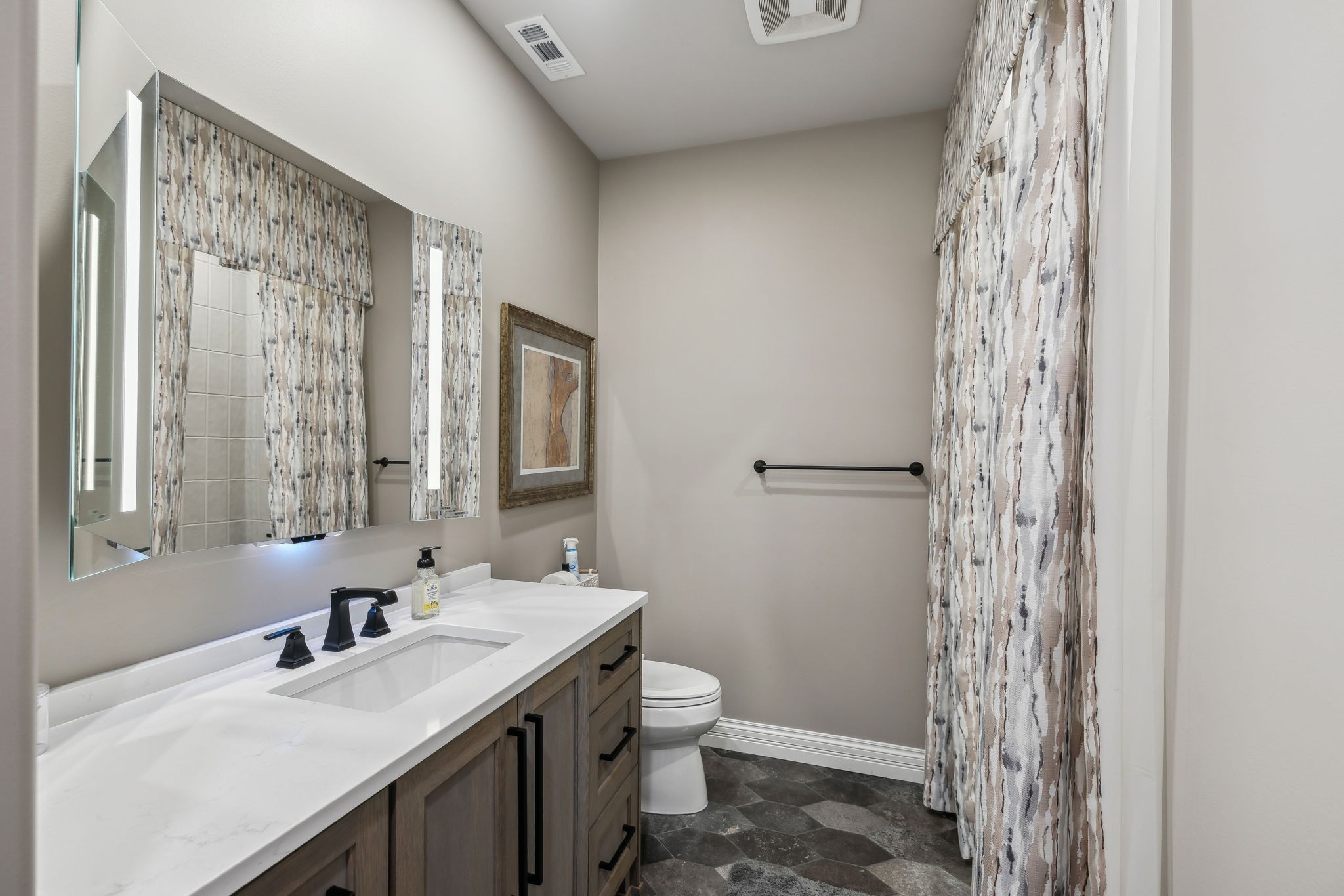 3235 Kinnard Springs Road Franklin, TN 37064 - Photo 77 of 99 a bathroom with a granite countertop sink a toilet and shower
