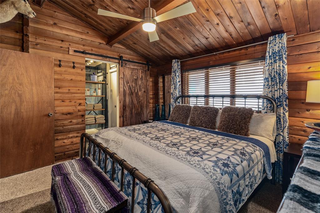 309 Shore Line Drive Tool, TX 75143 - Photo 11 of 23 a bed sitting in a bedroom next to a window