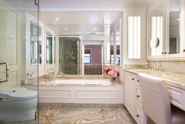 a bedroom with a large bed and a large window