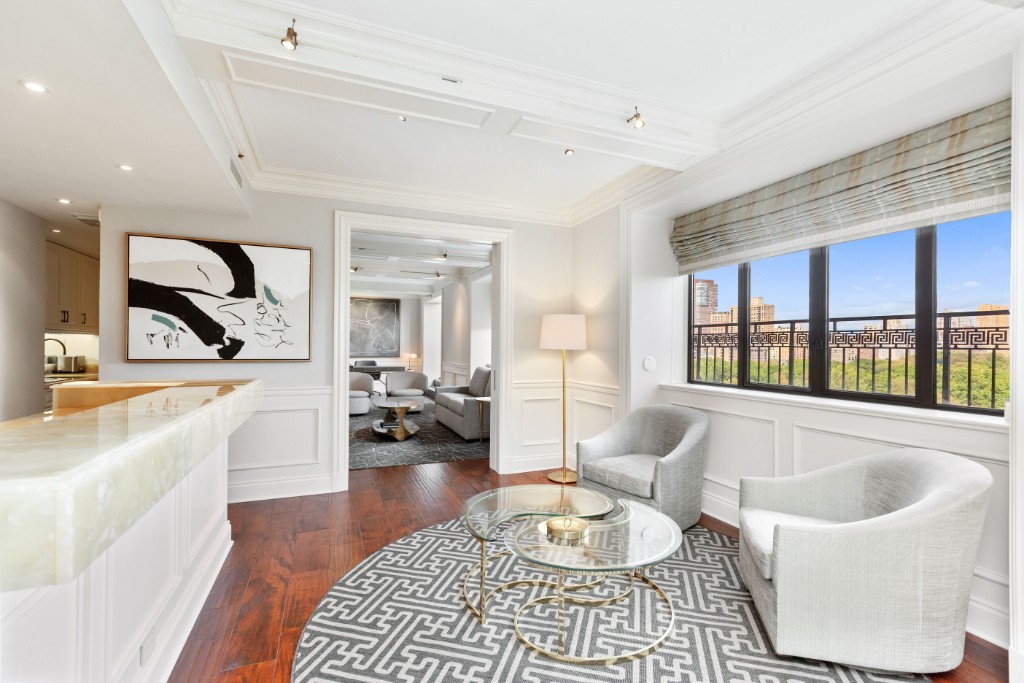 160 Central Park South, Unit 1201 Manhattan, NY 10019 - Photo 5 of 20 a living room with furniture and a large window