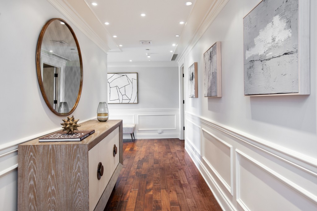 160 Central Park South, Unit 1201 Manhattan, NY 10019 - Photo 6 of 20 a room with stainless steel appliances a sink dishwasher and a stove with wooden floor