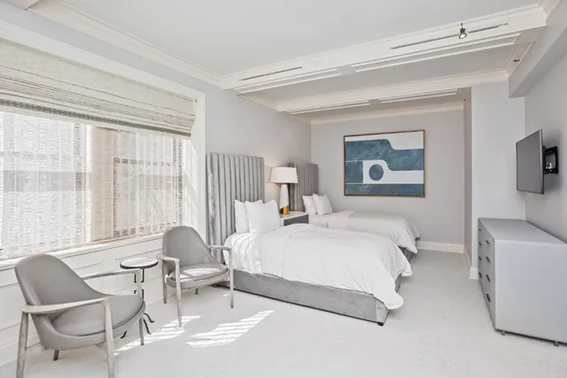 a room with stainless steel appliances a sink dishwasher and a stove with wooden floor