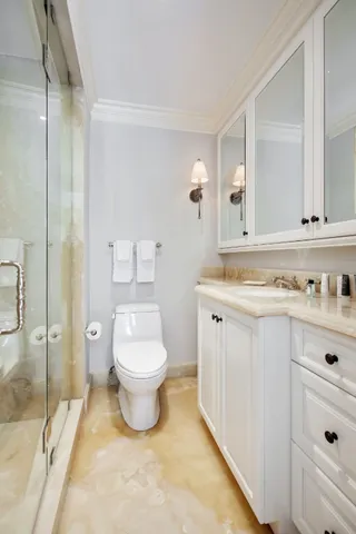 a bedroom with a bed a table and chair