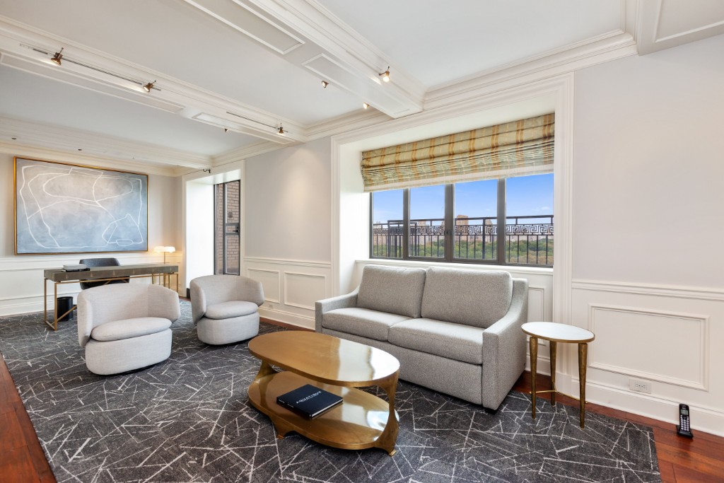 160 Central Park South, Unit 1201 Manhattan, NY 10019 - Photo 9 of 20 a living room with furniture and a large window