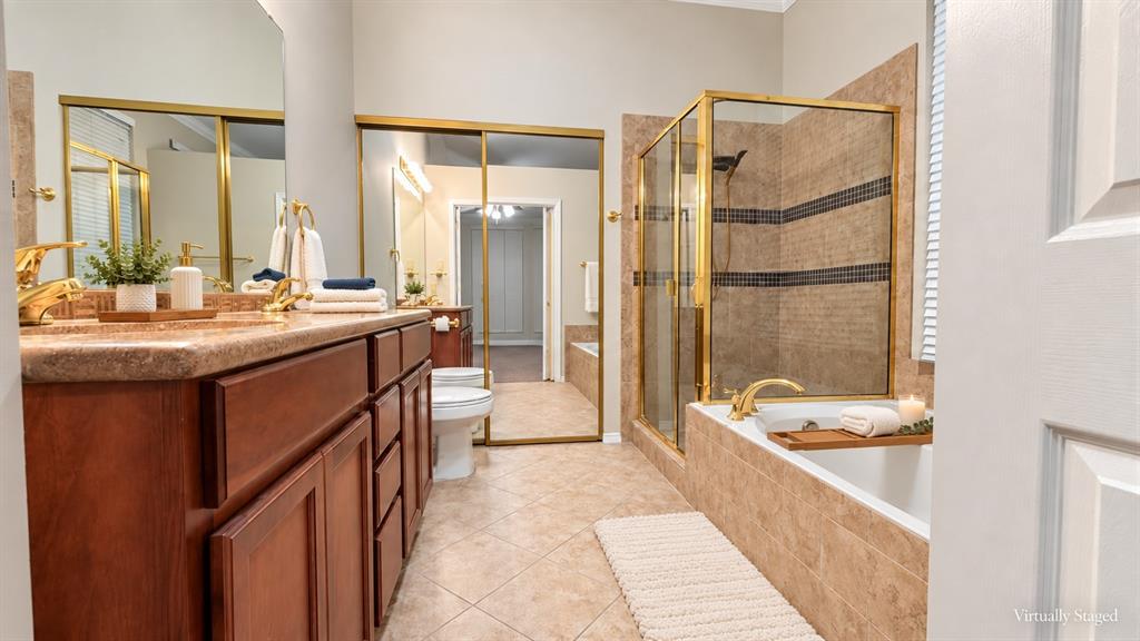 628 Raintree Circle Coppell, TX 75019 - Photo 6 of 30 Dual vanity with gold-finish fixtures and an integrated countertop