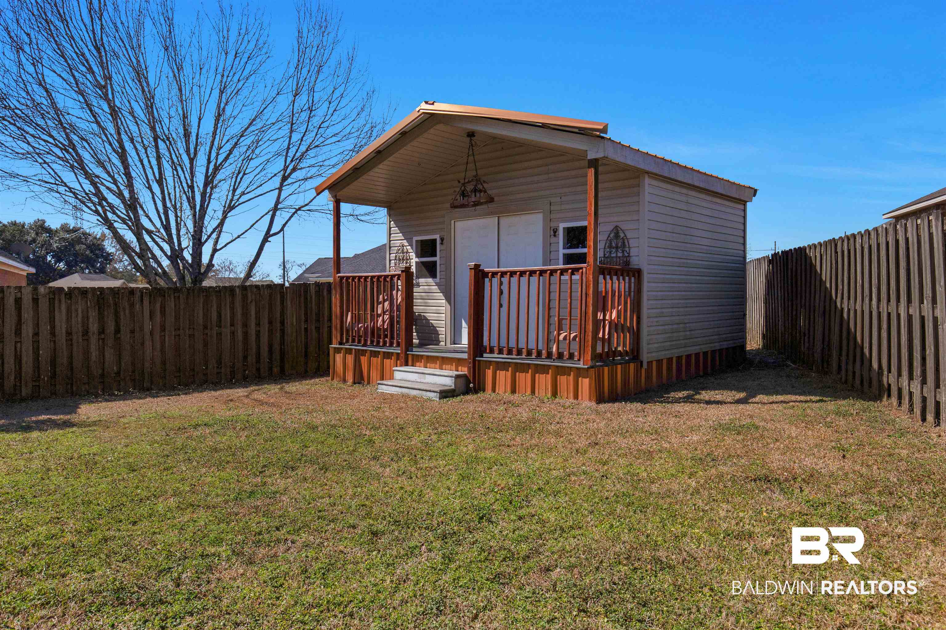 330 Allison Court Mobile, AL 36608 - Photo 26 of 27 Back of property featuring a deck and a lawn