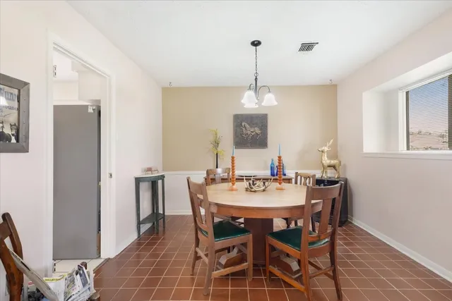 a view of a dining room and a table and chairs