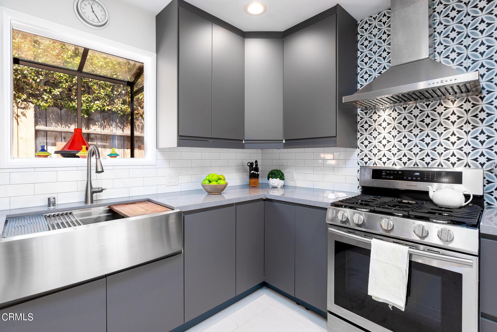2399 Brigden Road Pasadena, CA 91104 - Photo 11 of 32 a kitchen with granite countertop stainless steel appliances a sink a stove and a window
