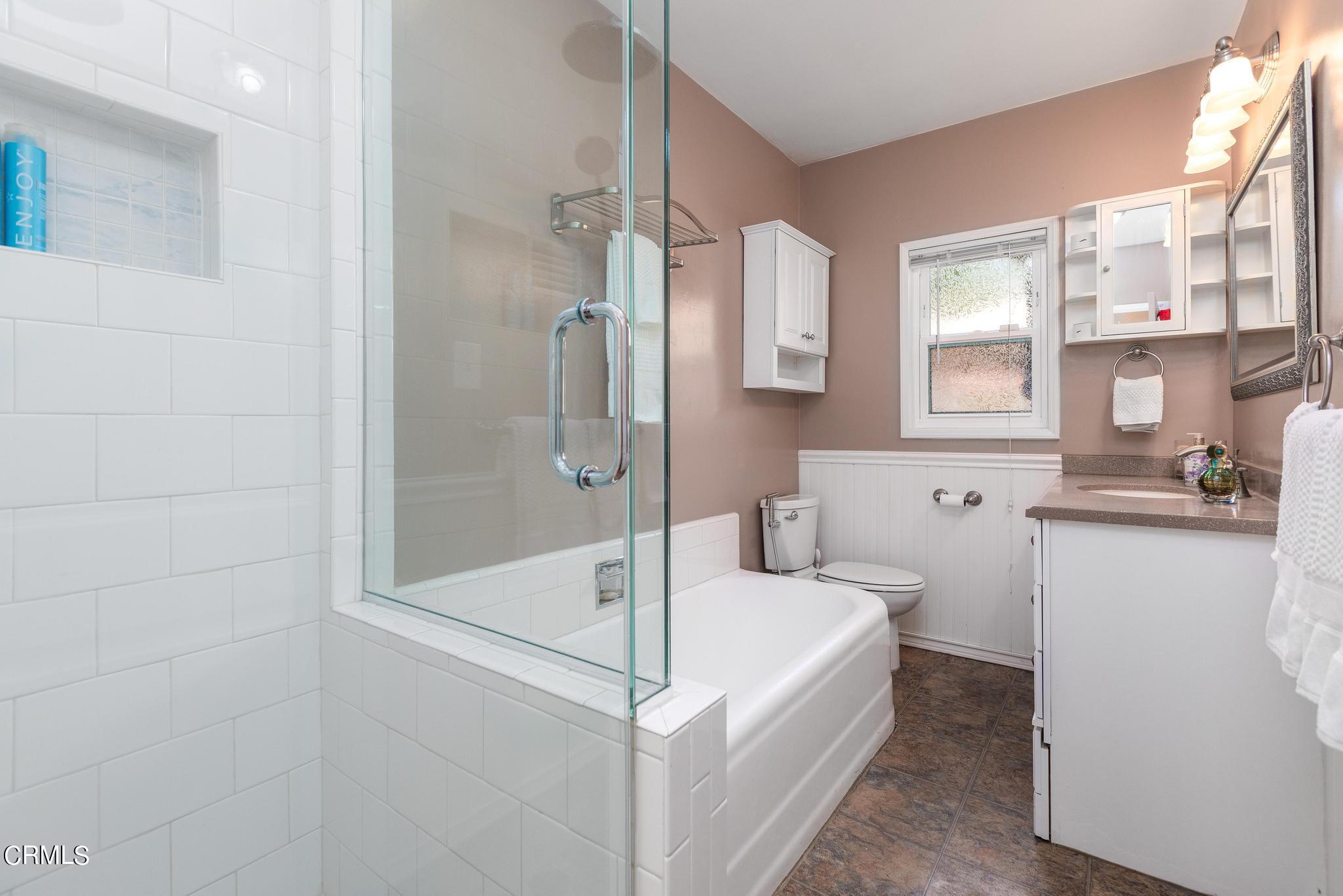 2399 Brigden Road Pasadena, CA 91104 - Photo 19 of 32 a bathroom with a tub and a shower