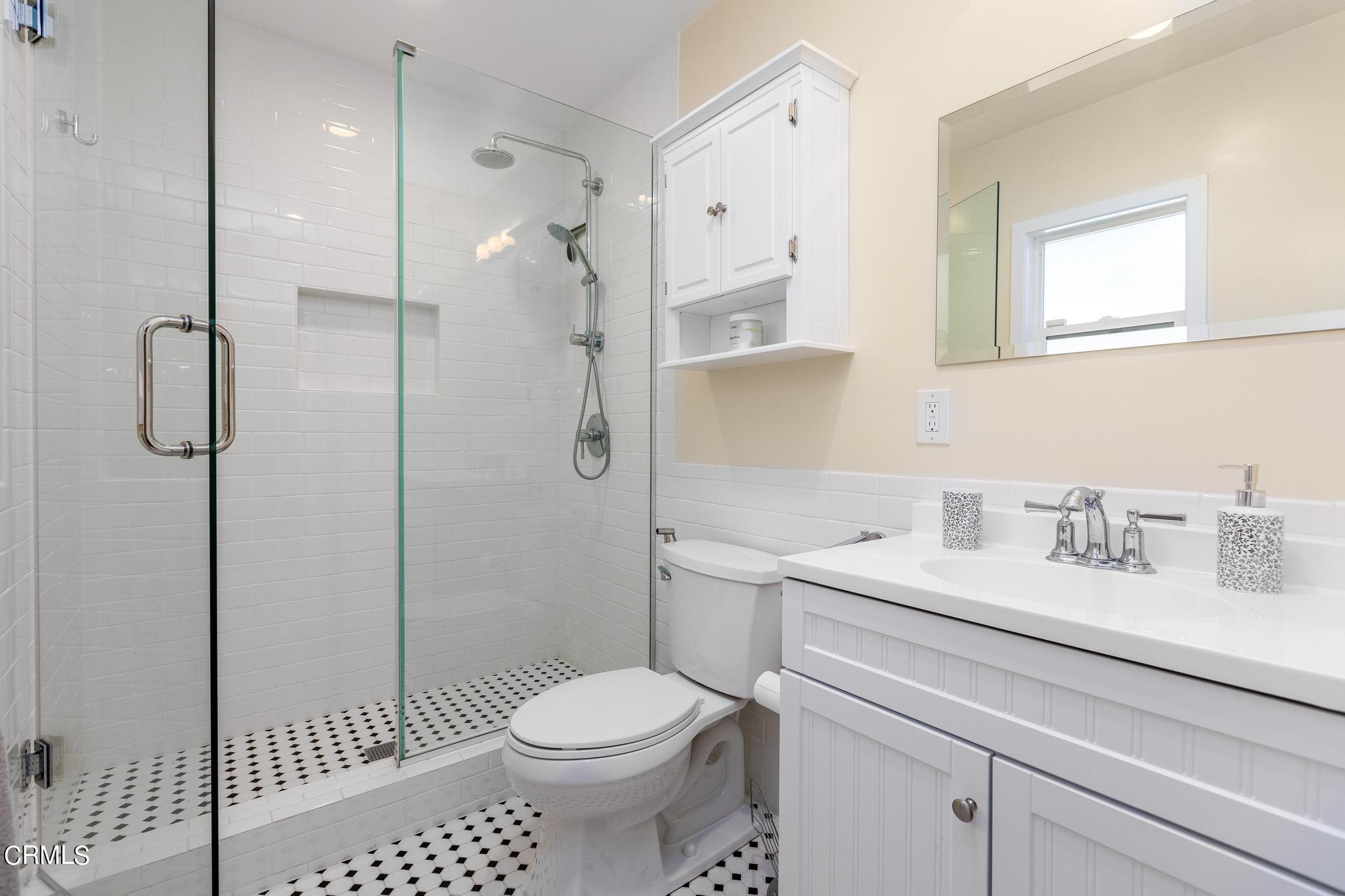 2399 Brigden Road Pasadena, CA 91104 - Photo 20 of 32 a bathroom with a sink toilet vanity and shower