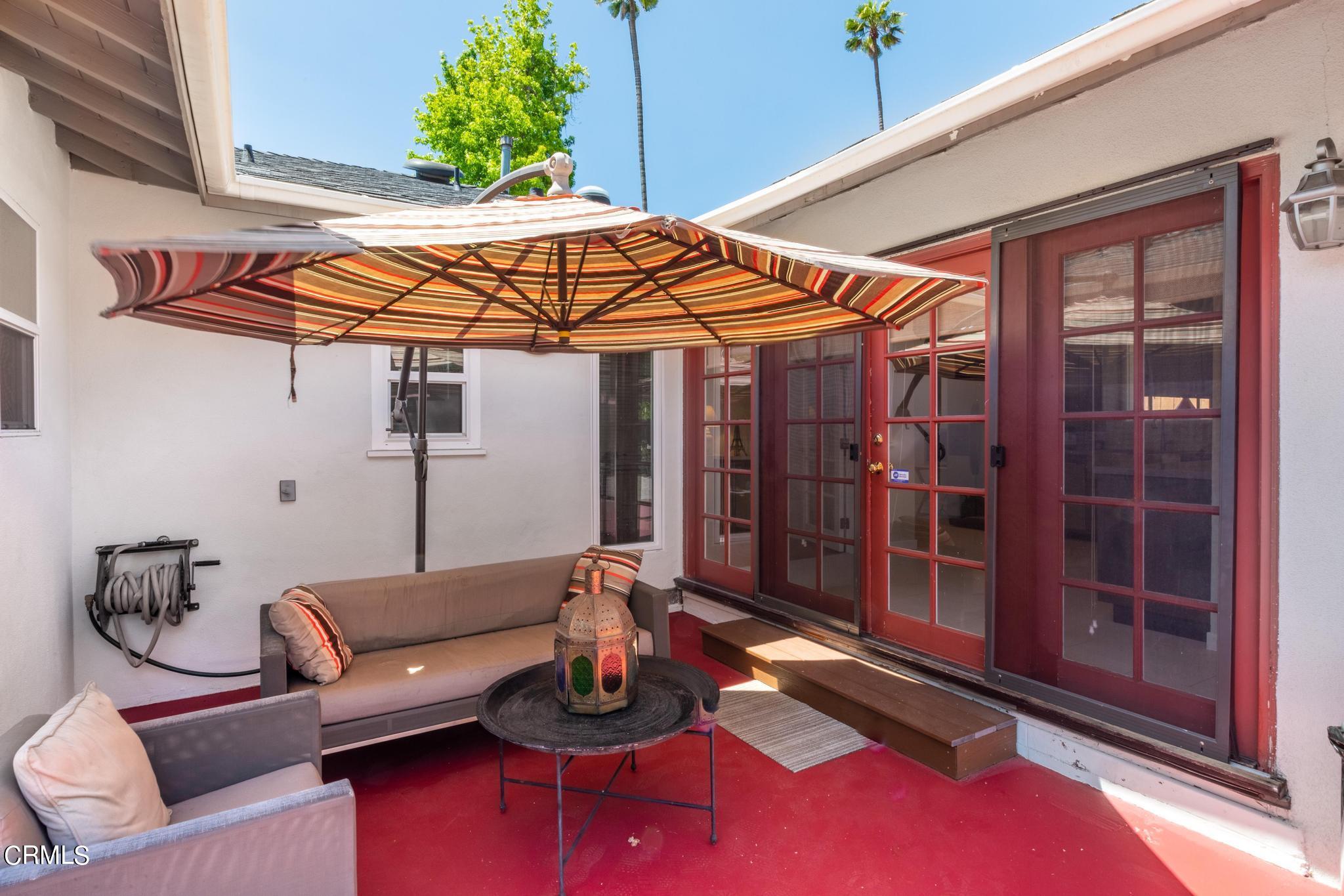2399 Brigden Road Pasadena, CA 91104 - Photo 22 of 32 a view of a patio with couches chairs and potted plants