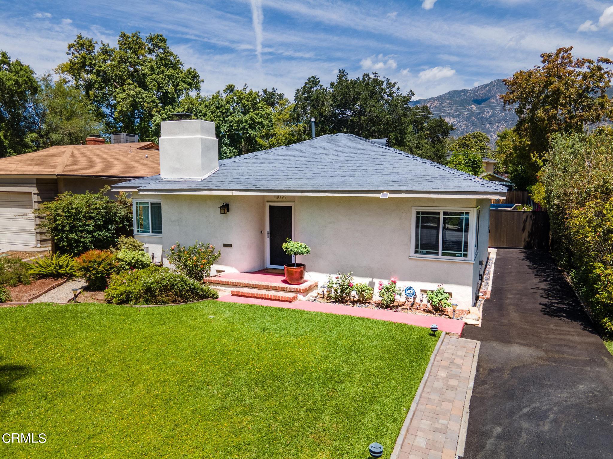 2399 Brigden Road Pasadena, CA 91104 - Photo 29 of 32 a front view of a house with a garden and plants