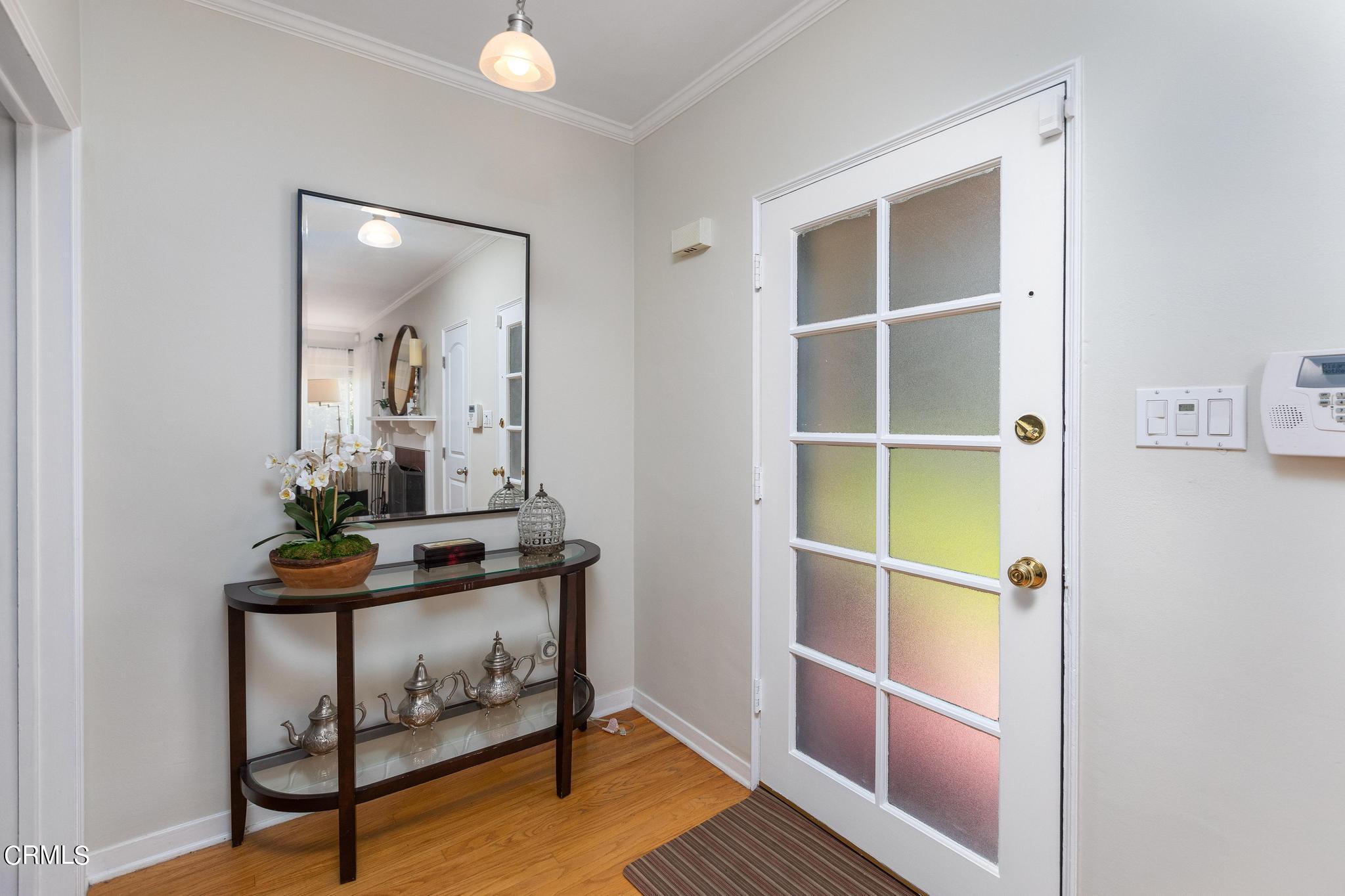 2399 Brigden Road Pasadena, CA 91104 - Photo 4 of 32 a room that has a table and a mirror in it