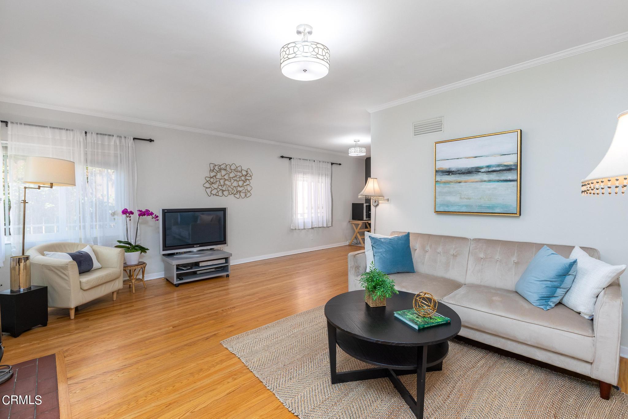 2399 Brigden Road Pasadena, CA 91104 - Photo 5 of 32 a living room with furniture a window and a flat screen tv