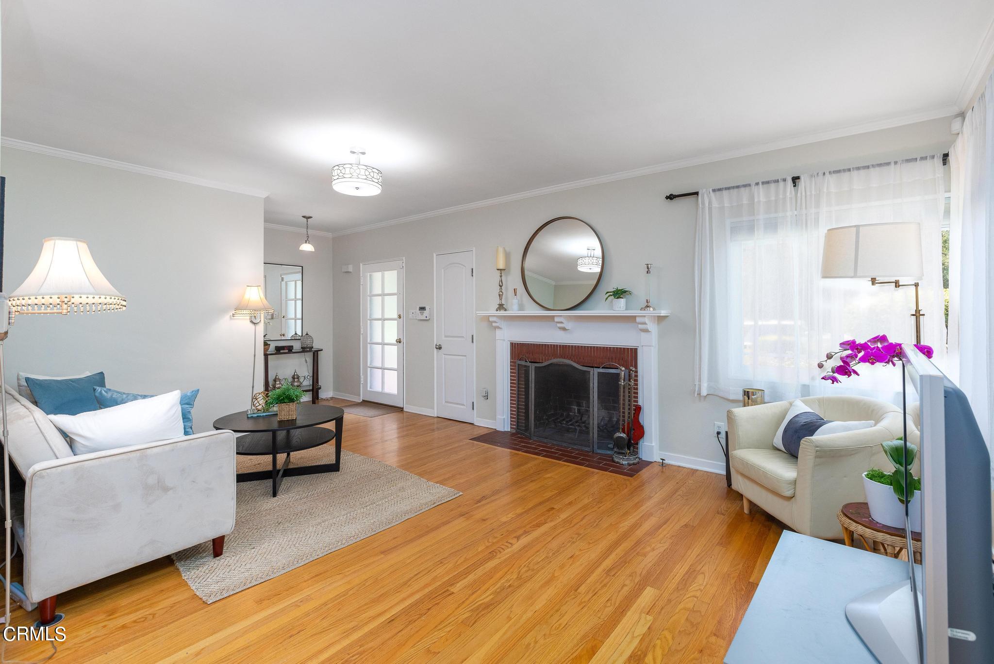 2399 Brigden Road Pasadena, CA 91104 - Photo 6 of 32 a living room with furniture and a fireplace