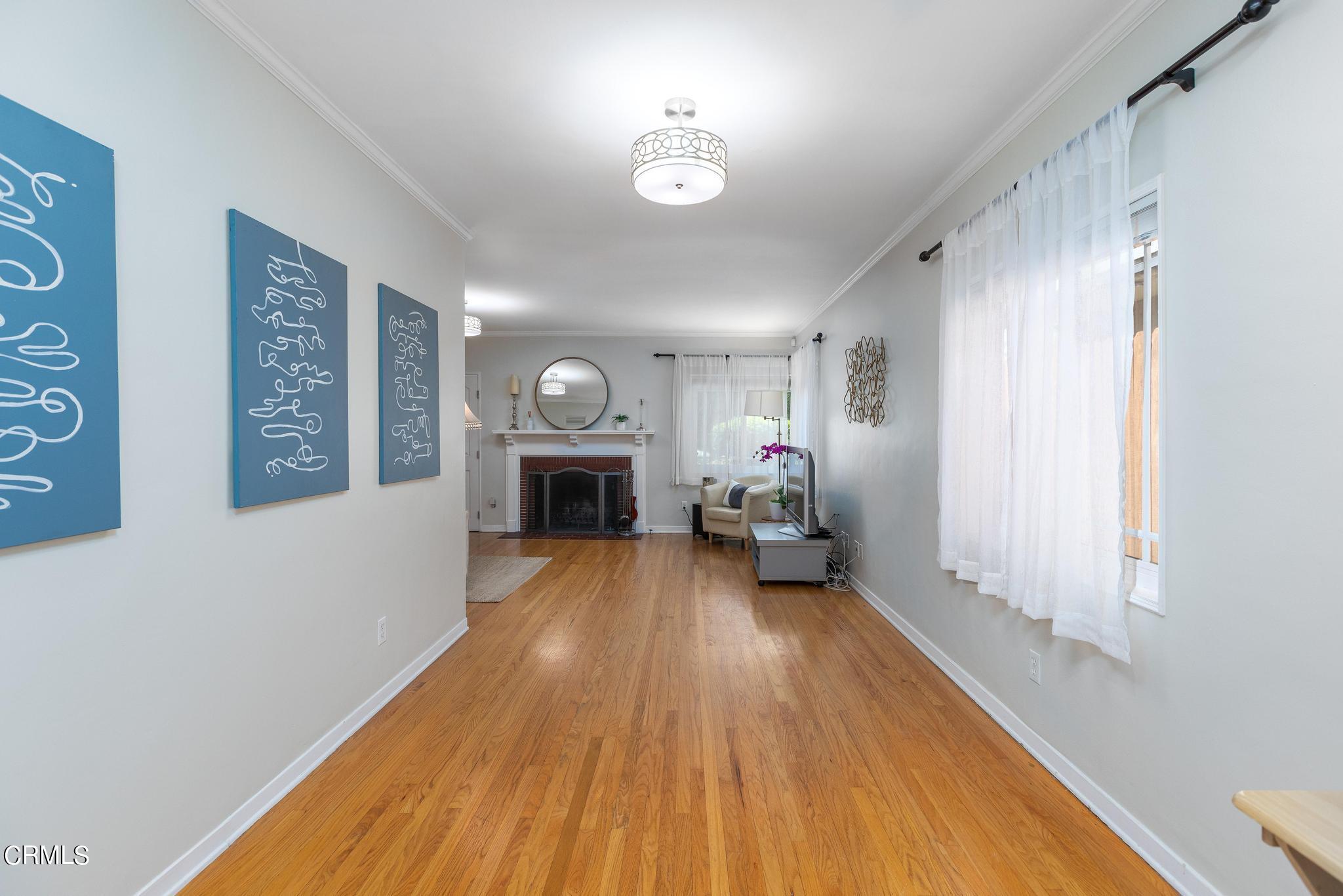 2399 Brigden Road Pasadena, CA 91104 - Photo 8 of 32 a living room with furniture and a fireplace