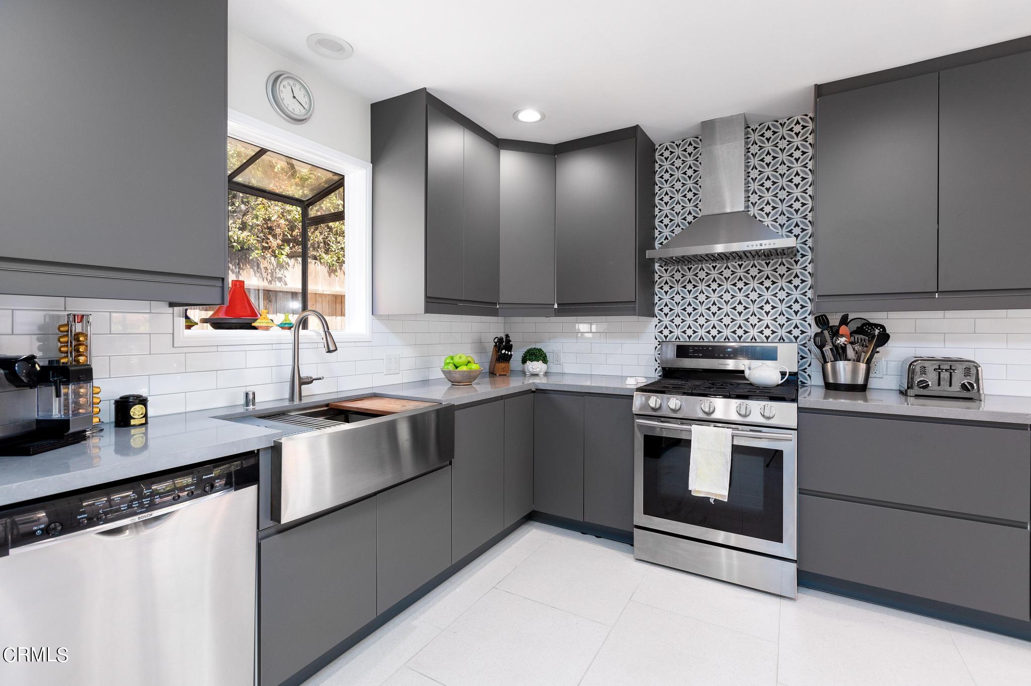 2399 Brigden Road Pasadena, CA 91104 - Photo 9 of 32 a kitchen with stainless steel appliances granite countertop a stove sink and cabinets
