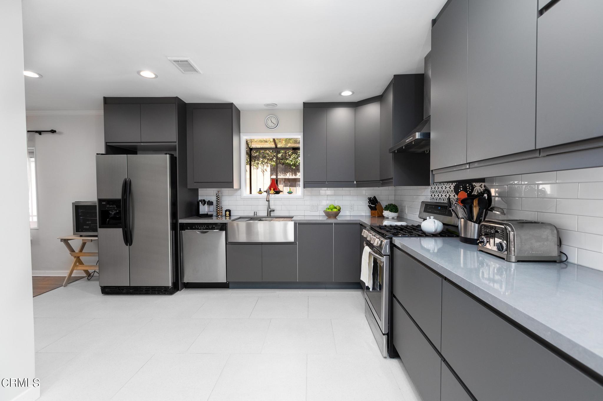 2399 Brigden Road Pasadena, CA 91104 - Photo 10 of 32 a kitchen that has a lot of cabinets and refrigerator