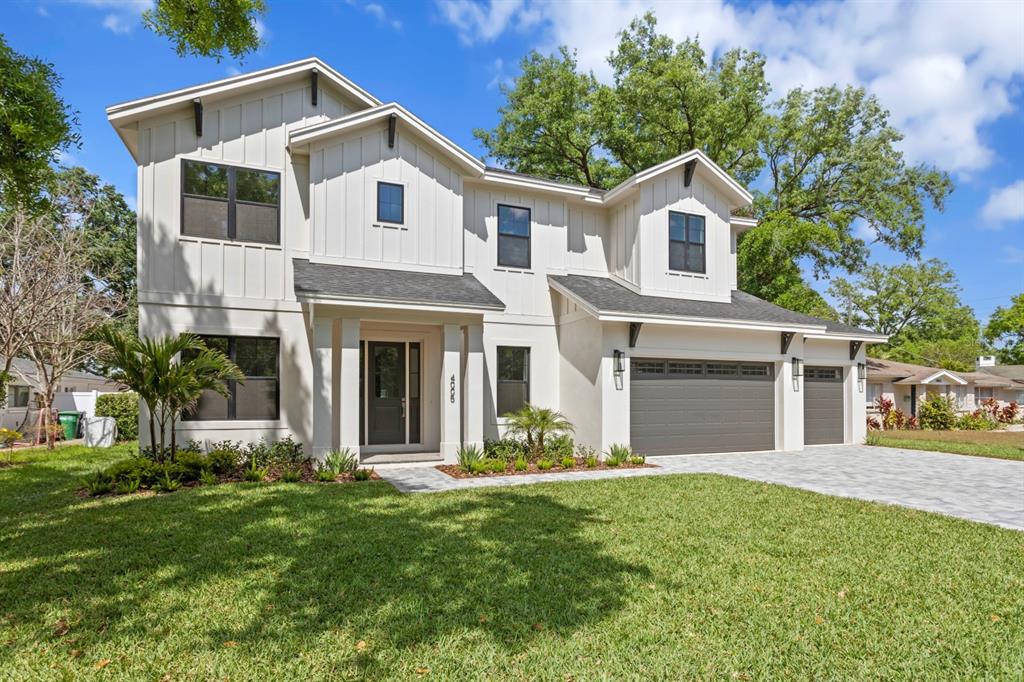 4005 West San Rafael Street Tampa, FL 33629 - Photo 1 of 1 a front view of a house with a yard and garage